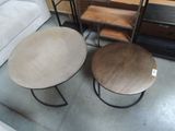 two tables that are sitting next to each other on the floor