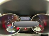 a close up of a car dashboard with various gauges