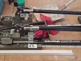 a lot of tools sitting on a table with a ruler