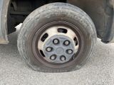 a flat tire on the side of a truck
