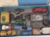 a blue box with a bunch of toy cars in it