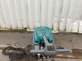 a blue machine that is laying on the ground