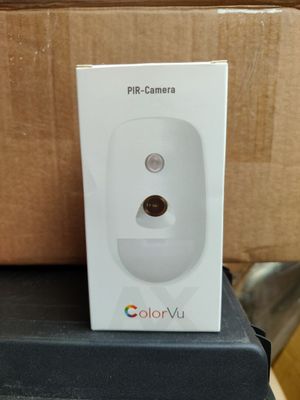 a box with a camera on top of it on a table