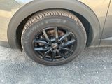 a close up of a tire on a car ' s rim