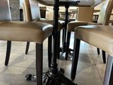 two chairs that are sitting at a table in a restaurant