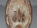 an image of a wooden mask on a white background