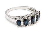 an image of a three stone ring with blue and white diamonds