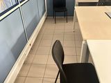 a room with a desk and a chair in it