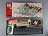 a box with a model of a house in it