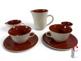 four cups and saucers sitting on a saucer