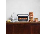 many sandwiches stacked on top of each other on a counter