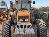 a tractor that is sitting in the dirt