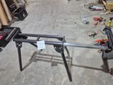 a picture of a workbench in a garage with tools on the floor