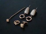 a pair of ear plugs and a pair of ear rings on a table