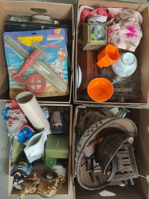 boxes filled with assorted items sitting on top of a floor