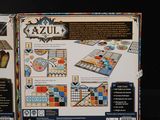 a box with a board game inside of it on a table