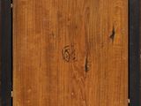 a close up of a wooden box with a painting on it