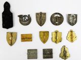 several different types of badges are displayed on a white surface