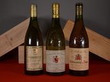 three bottles of wine sitting next to each other on a table