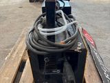 a picture of a pallet with a hose attached to it