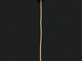 a close up of a gold and pearl broochle on a black background