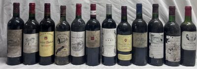 several bottles of wine are lined up on a table