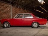 a red car that is parked in a garage