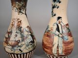 two vases sitting side by side on a table