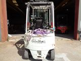 a forklift with a purple ribbon tied to it