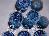 six blue glass knobs sitting on top of a table