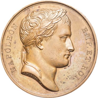 une image d'une pièce d'or avec le profil d'un homme