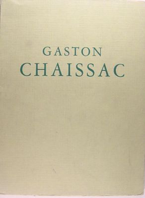 un vieux livre posé sur une table à côté d'une tasse de café
