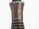 a small metal object that is sitting on a table