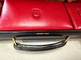 a red purse that is sitting on a table