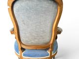 an image of a blue and white chair with a wooden frame