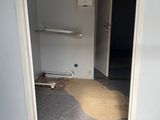 a room with a door that has been partially opened