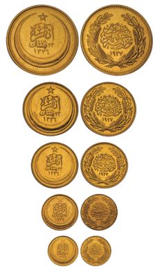 a group of gold coins on a white background