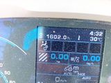 a close up of a car dashboard with a clock on it