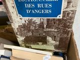 a box full of books with a sign on it