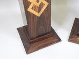 two pieces of wood that have been carved into the shape of a cross