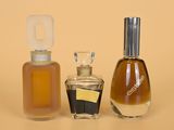 three different types of perfume bottles on a table