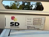 a picture of a service label on the side of a car