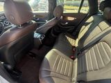 the interior of a car with two rows of seats and a steering wheel