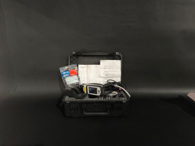 a black suitcase with a bunch of items inside of it