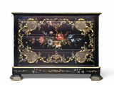 a chest of drawers with a floral design on the front