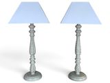 pair of silver table lamps with blue shades on white background