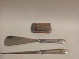 three different types of silverware sitting on a table