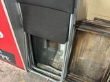 an image of a broken refrigerator outside of a building