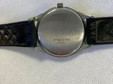 an image of a close up of a watch on a white surface