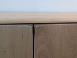 close up view of a wooden cabinet with two doors and a drawer